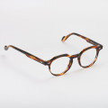 Thin and hexagonal-shaped eyeglasses model Amadeus in stripped havana color