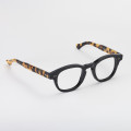 Classic black Boston eyeglasses with spotted havana temples