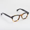 Classic black Boston eyeglasses with spotted havana temples